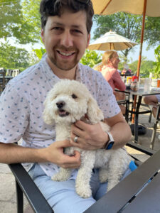 photo of Dan holding a dog